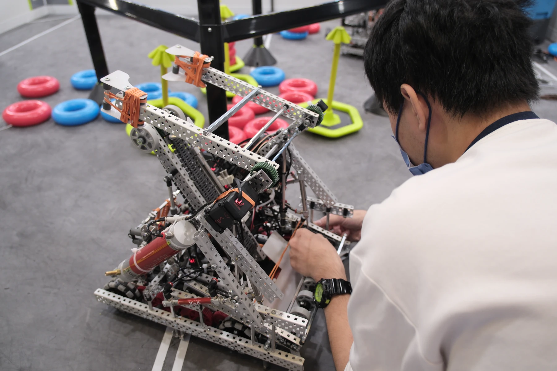 Assembling the final iteration of our robot, focusing on the ring intake and arm linkage.